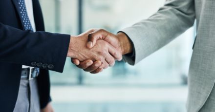 two people shaking hands